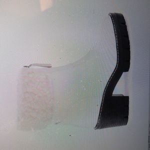 Woman's white faux fur trim boots.